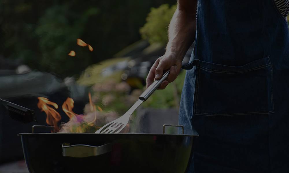 Man grilling in the backyard